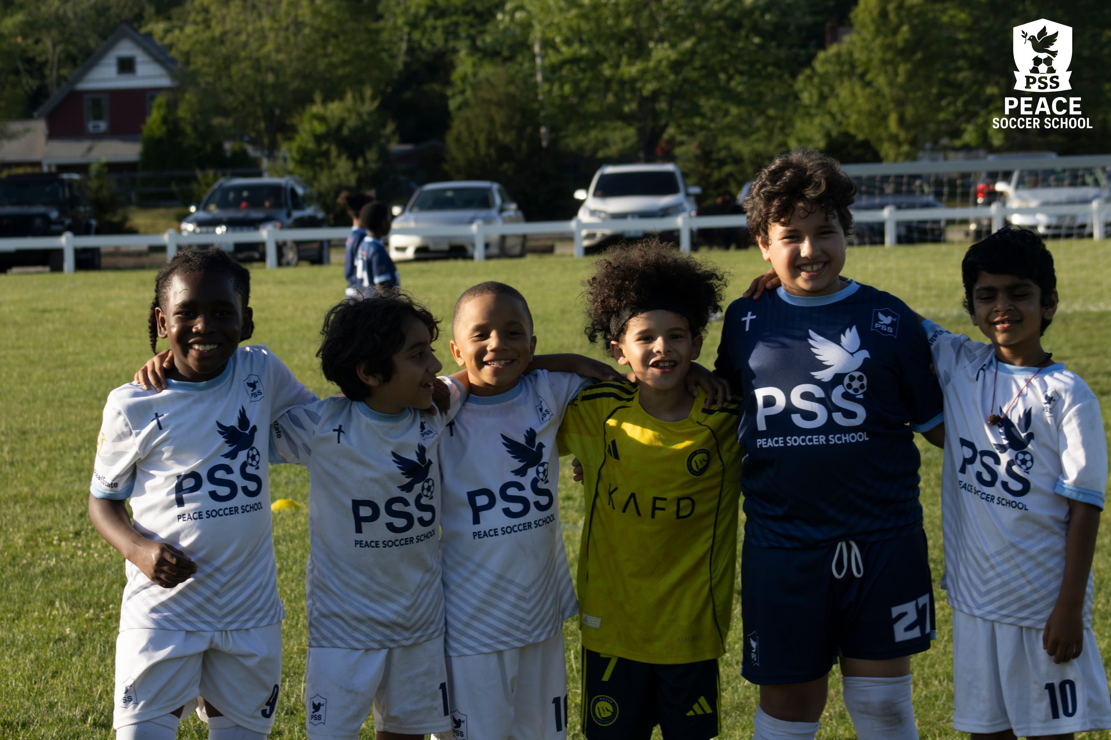 Kids running soccer drills in PSS gear at faith-based soccer academy